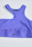 Top casual  morado reebok talla S 054