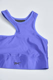 Top casual  morado reebok talla S 054